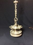 An 18th century Islamic hanging oil lamp
The central bowl with nine wick rests.  The lamp 19.5 cm