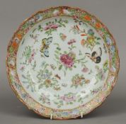 A Chinese Canton porcelain plate
Typically decorated with butterflies and floral sprays.  31 cm