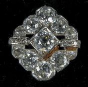 An Art Deco diamond set unmarked white metal flowerhead ring
The central stone approximately 0.5