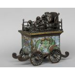 A Chinese cloisonne decorated bronze model of a wagon
The top mounted with musicians above the