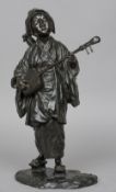 A Japanese Meiji period bronze figure
Modelled as a female musician, impressed signature to base.