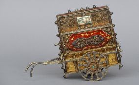 A white and gilt metal enamel decorated and semi-precious stone set model of a street organ, stamped