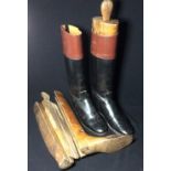 A pair of gentleman's hand-made leather riding boots 
With traditional tan leather tops; together