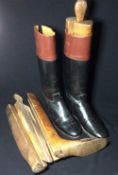 A pair of gentleman's hand-made leather riding boots 
With traditional tan leather tops; together