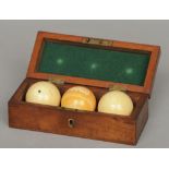 A set of three Edwardian ivory billiard balls
In a fitted mahogany box with applied white metal