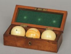 A set of three Edwardian ivory billiard balls
In a fitted mahogany box with applied white metal