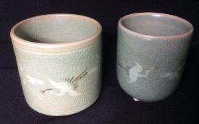 Two Korean pottery beakers
Both typically decorated with cranes, the smaller with two character