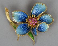 A ruby set enamel decorated yellow metal floral spray brooch
5 cm high. CONDITION REPORTS: Some