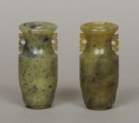 A pair of Chinese Republic Period carved speckled green and black jade vases
10 cm high.  (2)