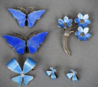 A small collection of Norwegian enamel decorated silver jewellery
Comprising: four brooches and a