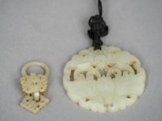A Chinese carved jade bi disc
Worked and pierced as two butterflies; together with a carved and