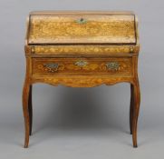 A 19th century Dutch marquetry inlaid oak bureau
Of bombe form, the fall enclosing a fitted interior