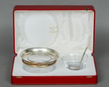 A French silver mounted glass caviar dish, bowl and caviar spoon by Cartier, Paris, the bowl rim
