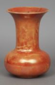 A Ruskin pottery vase
With allover orange lustre glaze, impressed marks and dated 1922.  22 cm high.