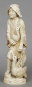 A large Japanese carved ivory okimono
Formed as a cormorant fisherman, modelled standing with two