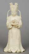 A Chinese carved ivory figure
Modelled as a girl in flowing robes and ornate headdress holding a jue