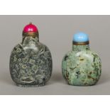 Two Chinese carved hardstone snuff bottles 
Both with coloured hardstone stoppers.  8 cm and 6.5