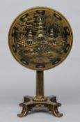 A Victorian wine table
The mother-of-pearl inlaid and chinoiserie decorated tilt top supported on