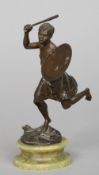 A late 19th/early 20th century patinated bronze model of a tribal warrior
Modelled holding a spear