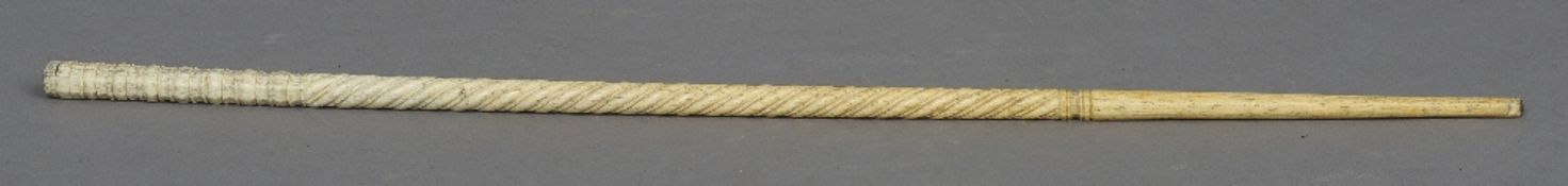 An 18th/19th century whale bone cane 
Spiral carved.  79 cm long. CONDITION REPORTS: Generally in