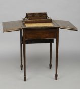 A small Edwardian line inlaid mahogany fold-over writing table
The interior with rising mechanism