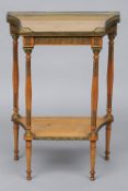 A late 19th century French satinwood side table
The pierced galleried top enclosing a glass plate