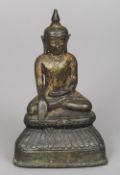 A Ming period gilt bronze Buddha
Typically modelled in the lotus position with traces of original