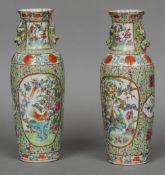 A pair of Chinese porcelain vases
Each with crimped rim and decorated with exotic bird vignettes