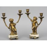 A pair of 19th century gilt metal mounted alabaster candelabra
Each with twin branches supported
