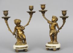 A pair of 19th century gilt metal mounted alabaster candelabra
Each with twin branches supported