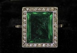 An Art Deco emerald and diamond set white metal ring
The central stone square cut, in fitted case