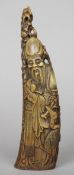 A Chinese carved horn figure, probably Shao Lao
25 cm high. CONDITION REPORTS: Some splits,