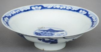 A Chinese blue and white porcelain stem bowl
Decorated with figures in a continuous garden.  18 cm