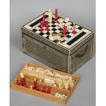 A 19th century Anglo-Indian ivory and ebony inlaid games compendium
The rectangular hinged top
