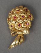 An 18 ct gold Tiffany ruby set brooch
Formed as a bow tied bouquet.  4.5 cm wide. CONDITION REPORTS: