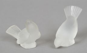 A pair of Lalique frosted glass birds
One head up, one head down, each inscribed to the underside