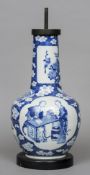 A Chinese porcelain blue and white vase
Of bottle form, decorated with figural vignettes depicting