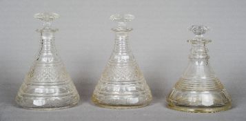 A pair of 19th century cut glass ship's decanters together with another similar
The former 23.5 cm