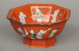 A 19th century Chinese porcelain footed octagonal bowl
Decorated with children at play on a coral