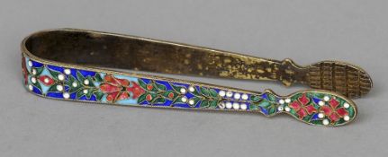 A pair of Russian white metal champleve enamelled tongs, indistinctly marked
Of typical form.  14 cm