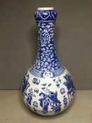 A Chinese blue and white porcelain bottle vase
Decorated with figures in traditional pursuits,