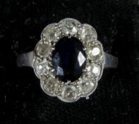 A sapphire and diamond set 18 ct white gold flowerhead ring
In fitted case for T.Y. Li & Co, Hong