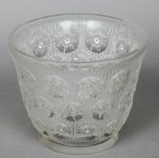 A Rene Lalique glass vase
Moulded flowerhead decoration, stencilled signature R Lalique, France to