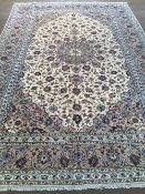 A Keshan wool carpet
351 x 240 cm. CONDITION REPORTS: Generally in good condition, expected wear.