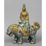 A 19th century cloisonne figure of Guanyin
Modelled seated holding a ruyi sceptre and seated on a