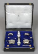A matched silver condiment set, retailed by Collingwood of Conduit Street Limited, London