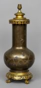 A Japanese inlaid bronze lamp base
Worked with birds and blossom sprays with gilt metal mounts.