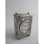 A SMALL SILVER CASED CLOCK, London 1902, G & S Co. Ltd, RD No 324950. Chased with shell and C-