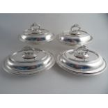 TWO PAIRS OF SILVERPLATED OVAL ENTRÉE DISHES AND COVERS with removable bead and leaf scroll handles