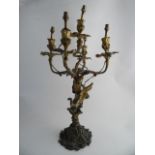 A FRENCH ROCOCO GILT METAL CANDELABRA TABLE LAMP. Five branches with leaf sconces, naturalistic stem